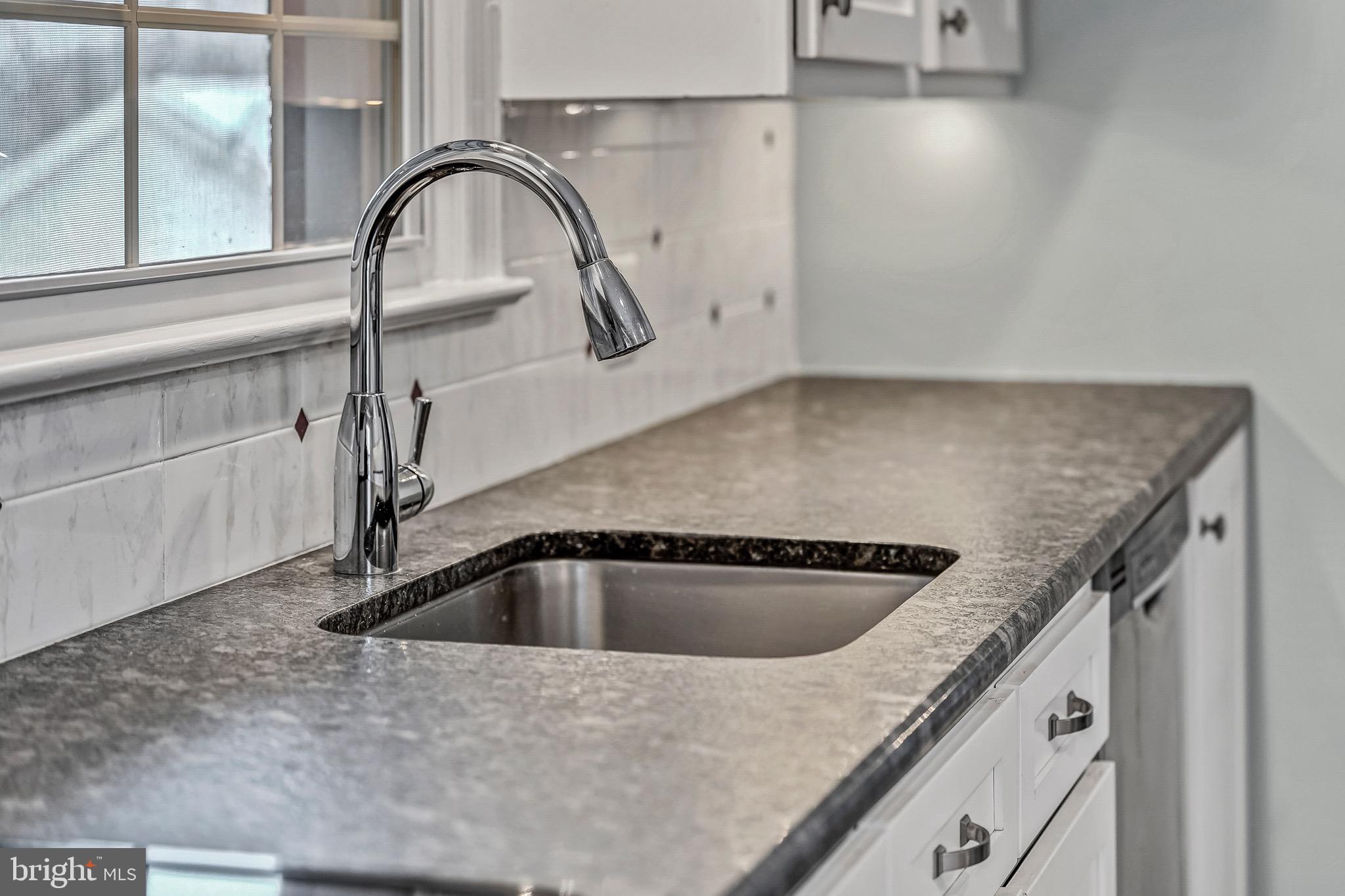 17747 Silcott Springs Road Purcellville, VA 20132 - Photo 11 of 42 a close view of sink and tap