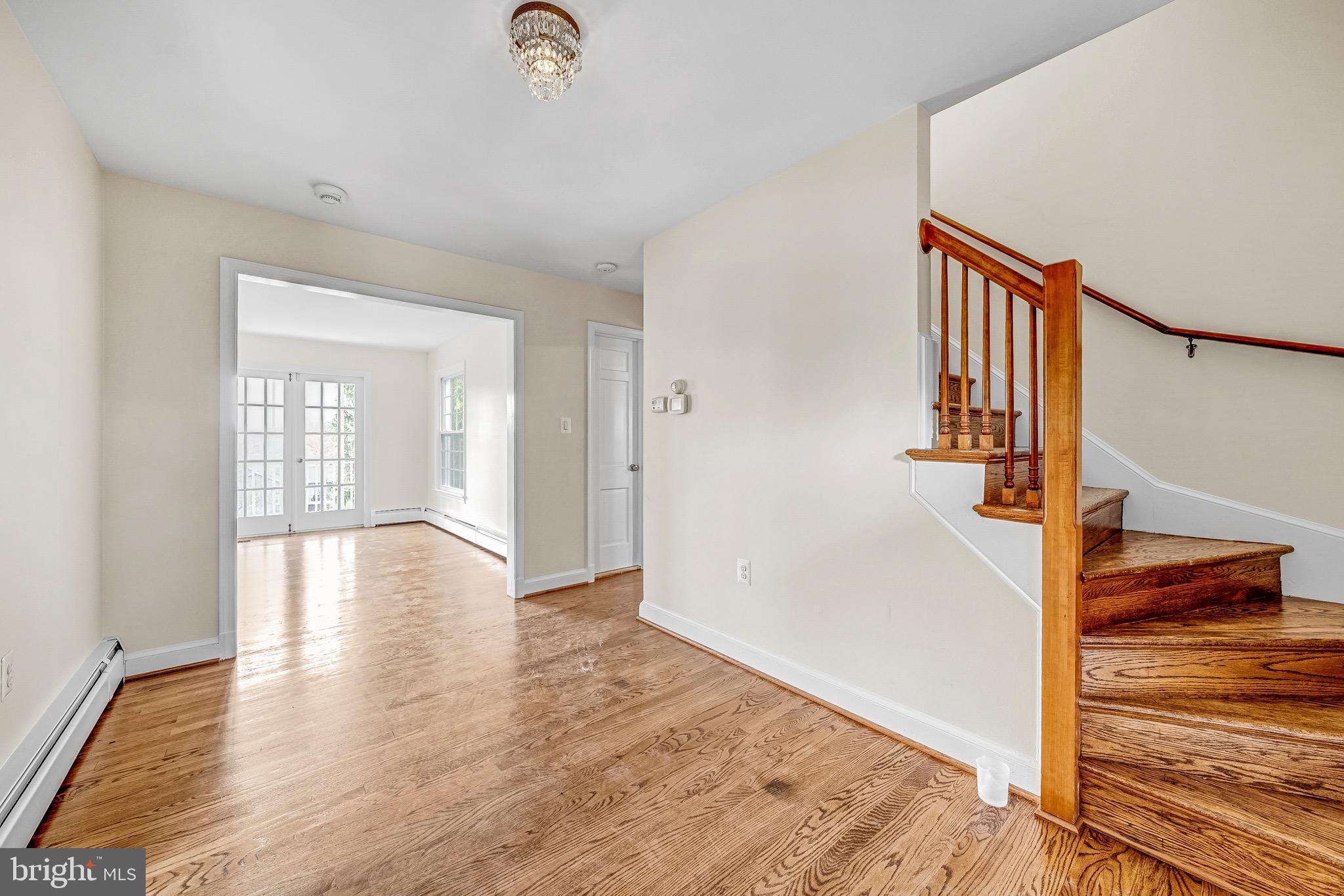 17747 Silcott Springs Road Purcellville, VA 20132 - Photo 14 of 42 a view of a hallway with wooden floor and staircase