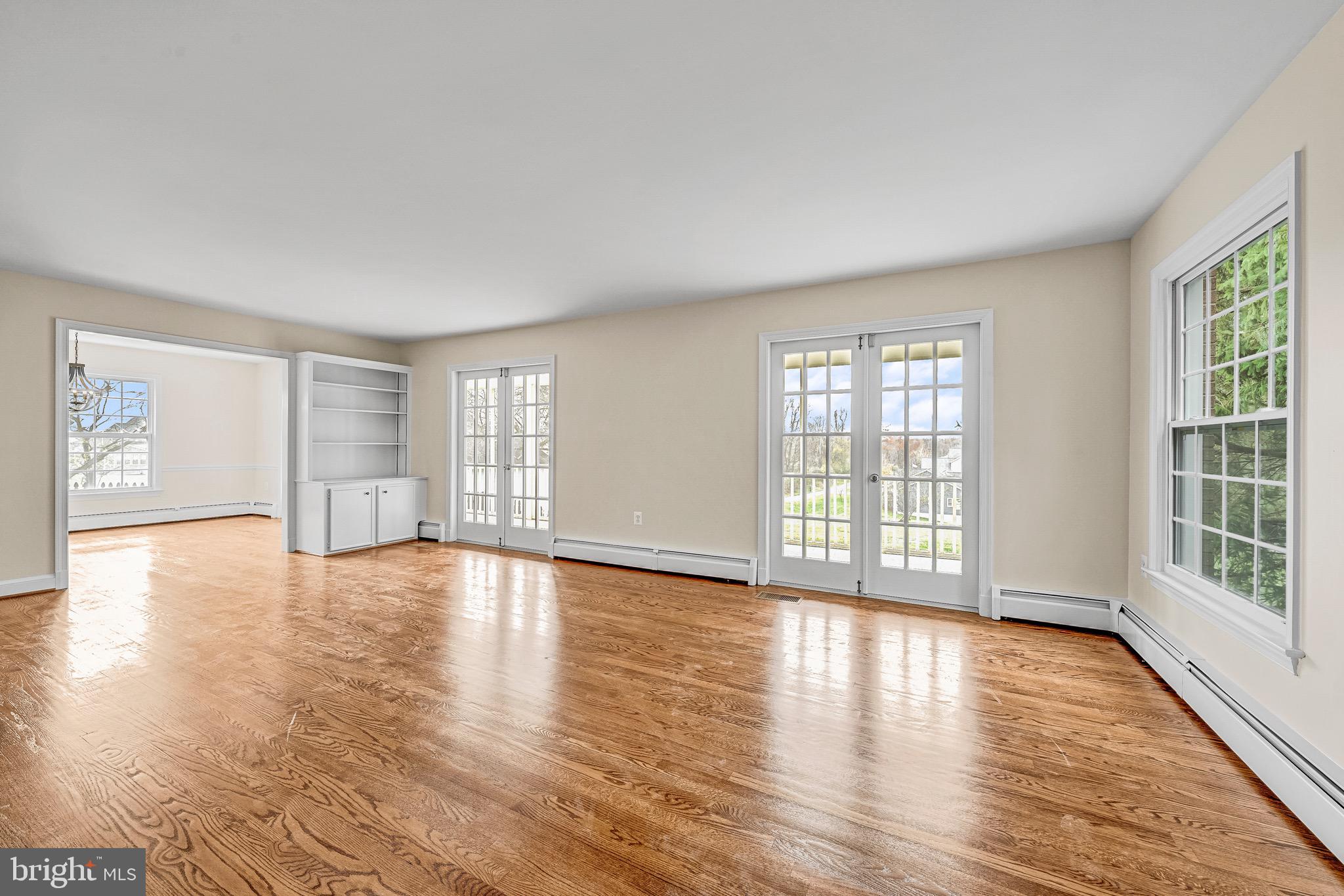17747 Silcott Springs Road Purcellville, VA 20132 - Photo 15 of 42 a view of an empty room with wooden floor and a window