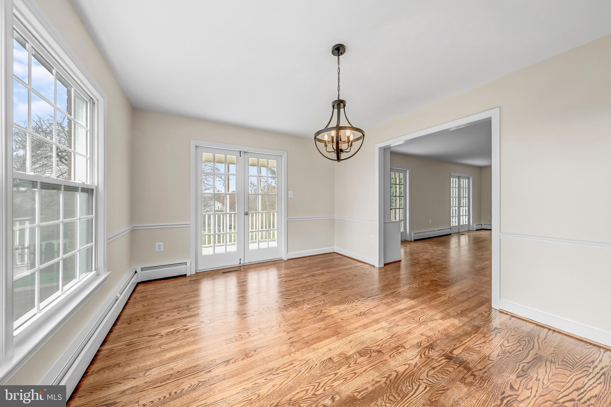 17747 Silcott Springs Road Purcellville, VA 20132 - Photo 21 of 42 a view of an empty room with window and wooden floor