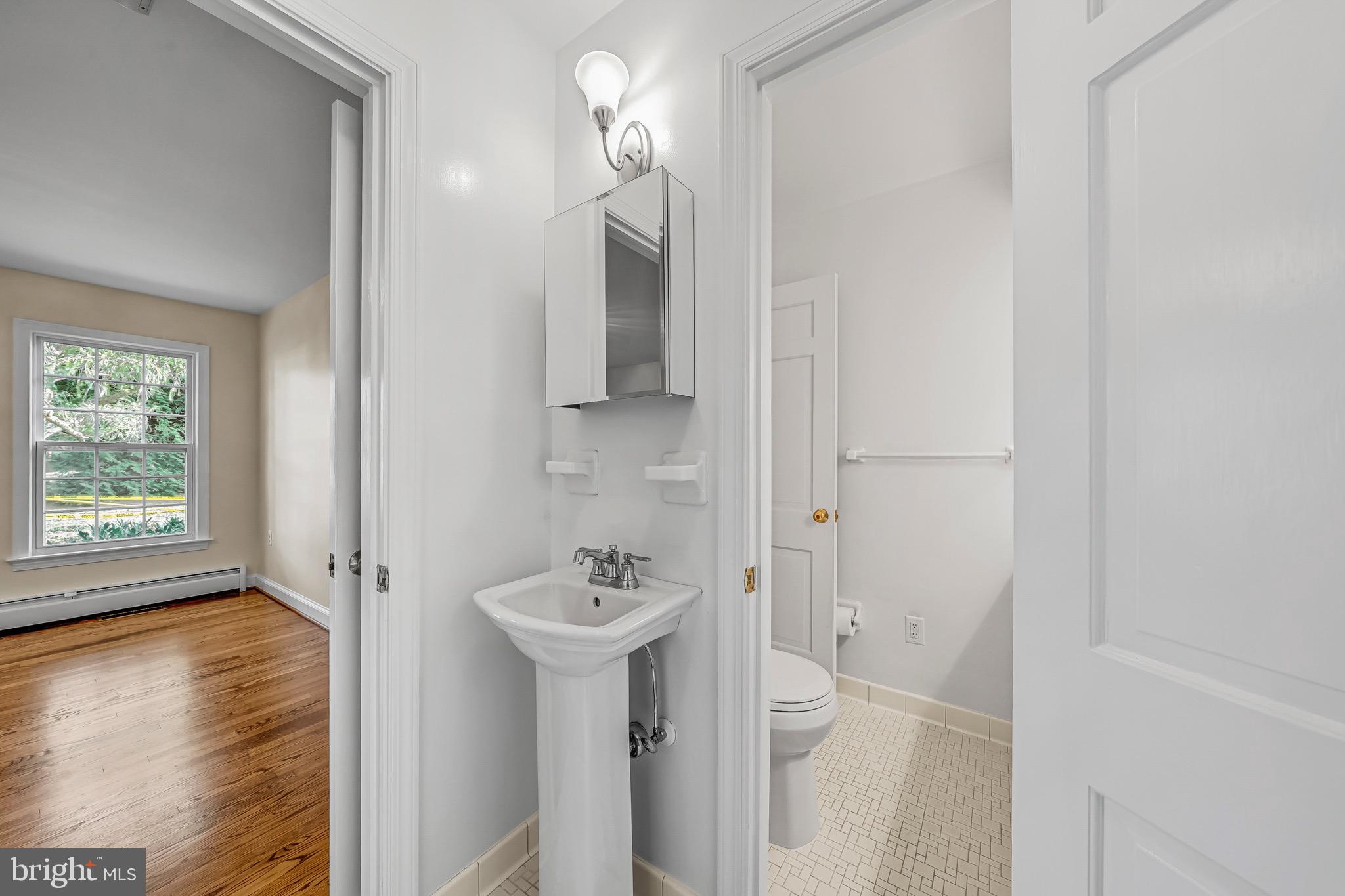 17747 Silcott Springs Road Purcellville, VA 20132 - Photo 25 of 42 a bathroom with a sink a toilet and shower