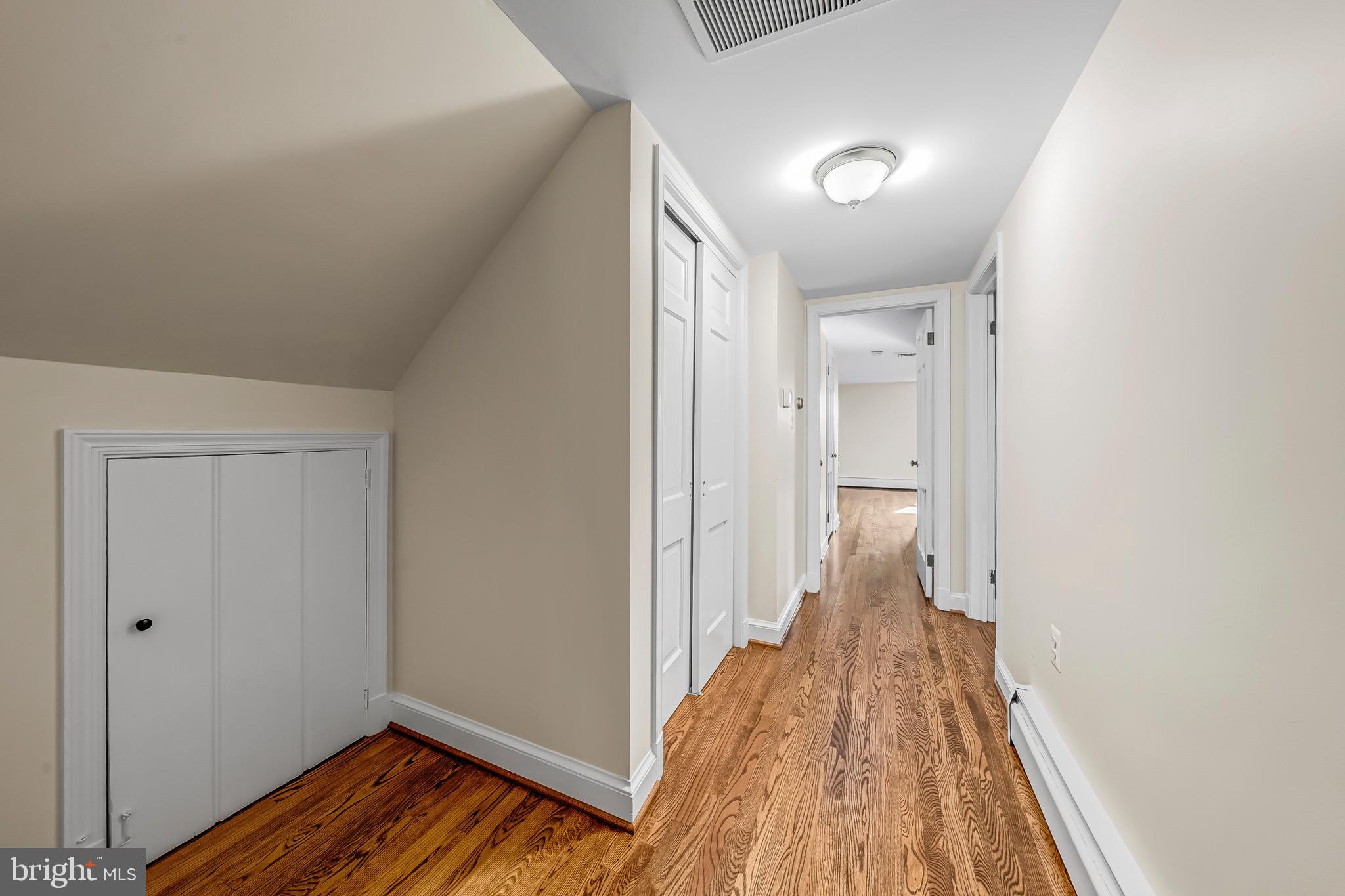 17747 Silcott Springs Road Purcellville, VA 20132 - Photo 27 of 42 a view of a room with wooden floor and staircase