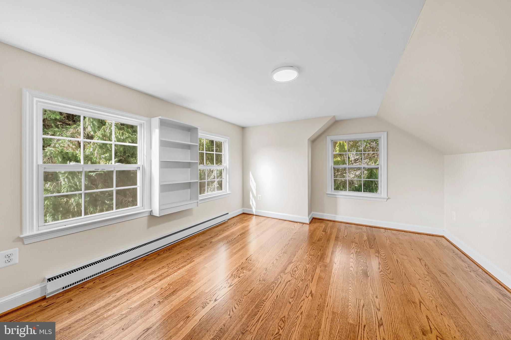 17747 Silcott Springs Road Purcellville, VA 20132 - Photo 32 of 42 an empty room with wooden floor and windows