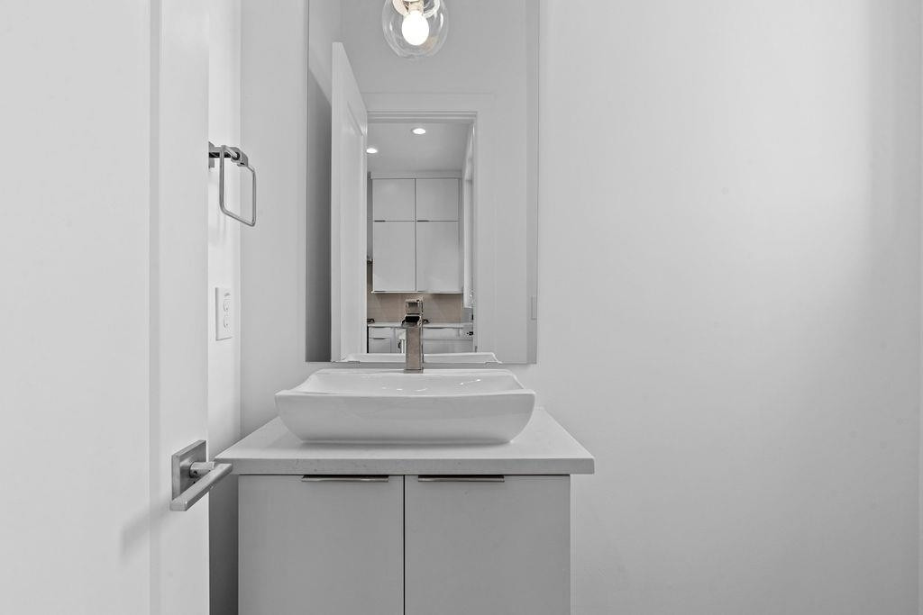 310 Mallard Avenue Durham, NC 27701 - Photo 15 of 41 a bathroom with a sink a vanity and a mirror