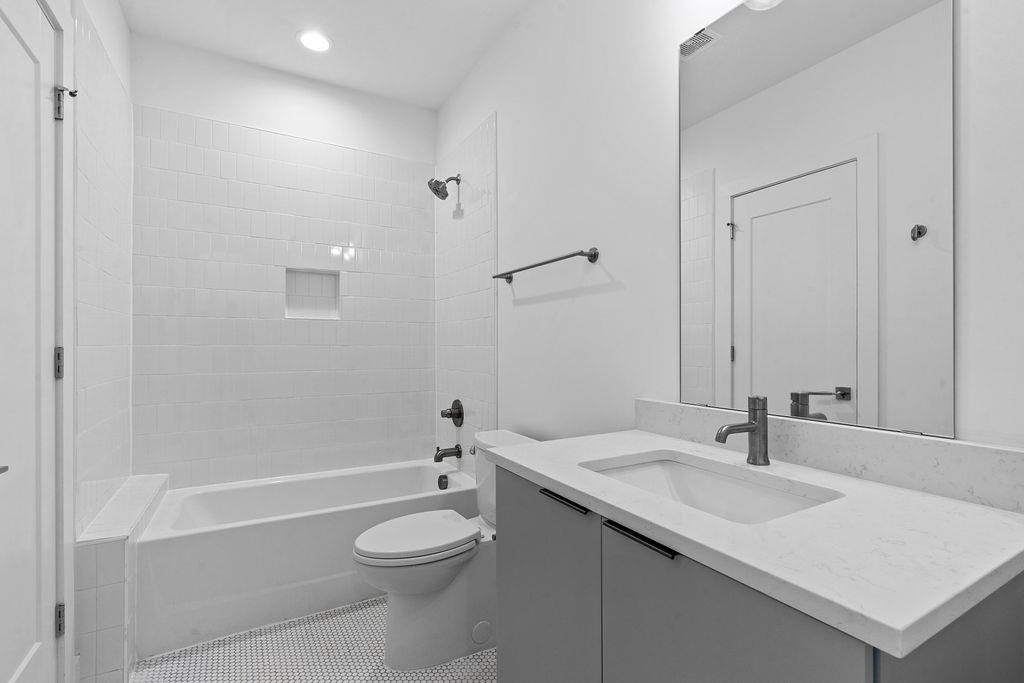 310 Mallard Avenue Durham, NC 27701 - Photo 17 of 41 a bathroom with a sink toilet and shower