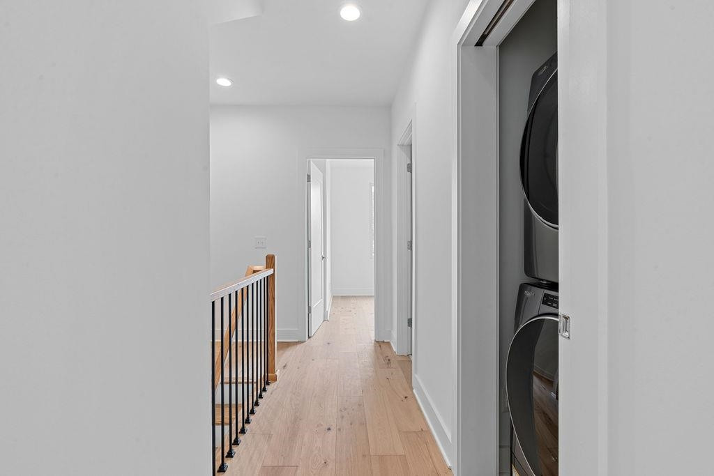 310 Mallard Avenue Durham, NC 27701 - Photo 19 of 41 a view of a hallway with wooden floor and staircase