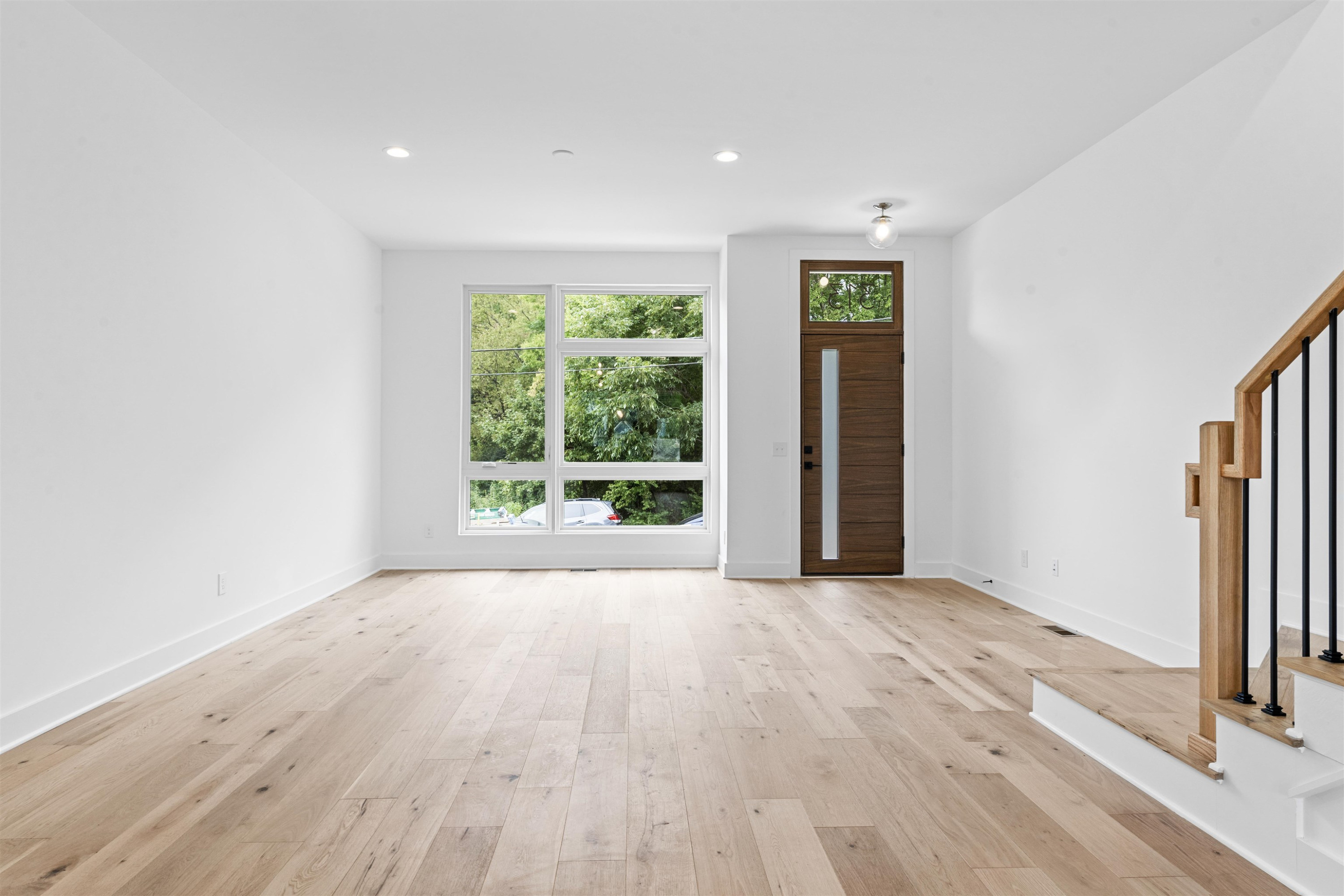 310 Mallard Avenue Durham, NC 27701 - Photo 2 of 41 a view of an empty room with wooden floor and a window