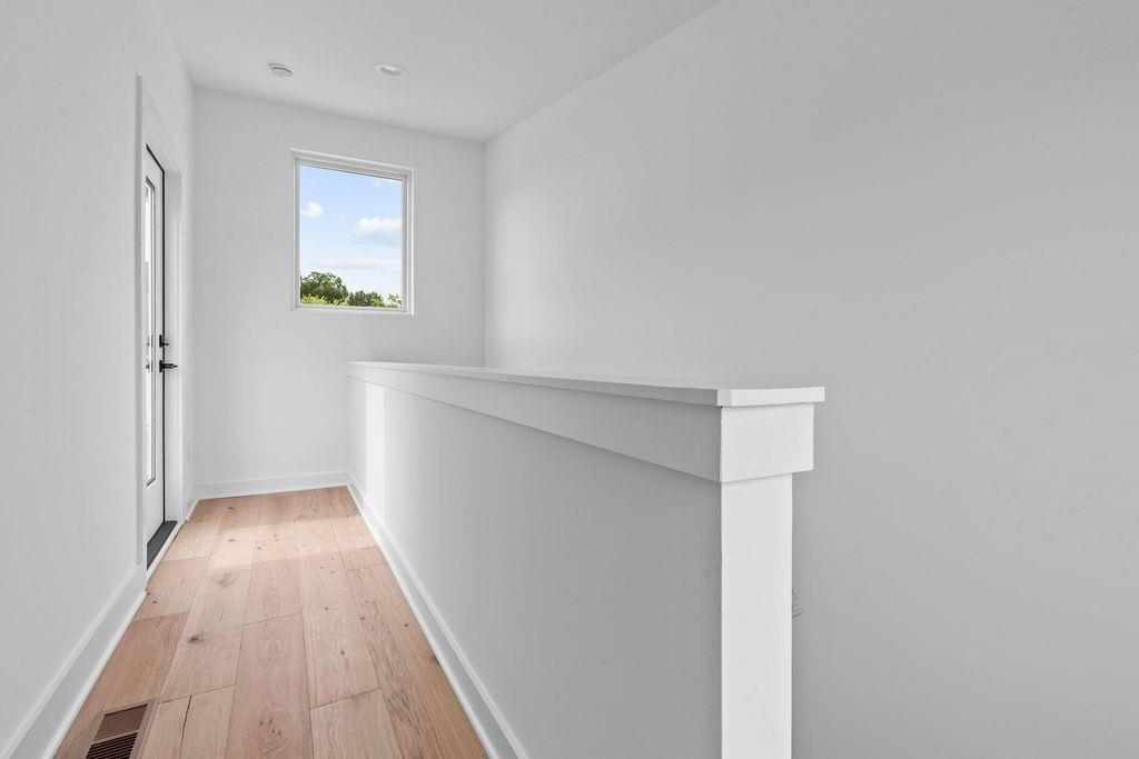 310 Mallard Avenue Durham, NC 27701 - Photo 24 of 41 a view of an empty room with wooden floor and a window