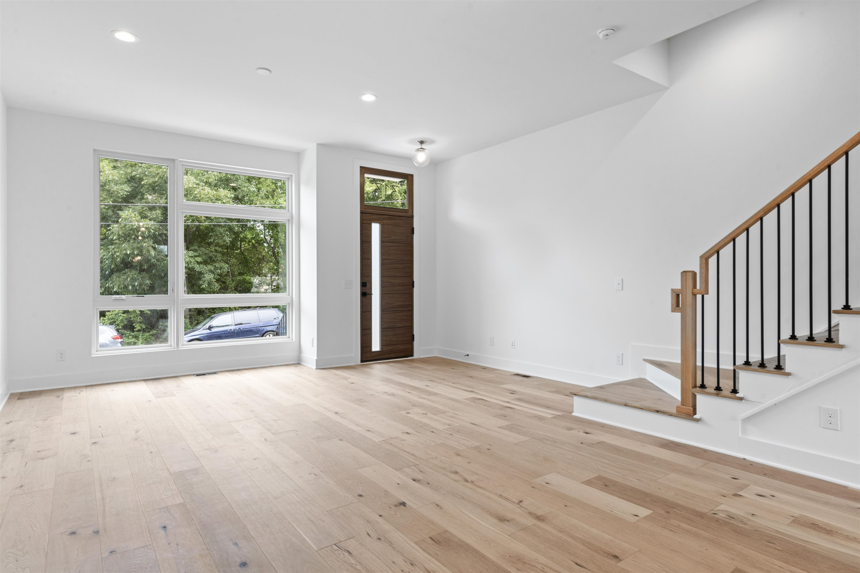 310 Mallard Avenue Durham, NC 27701 - Photo 8 of 41 a view of an empty room with wooden floor and a window
