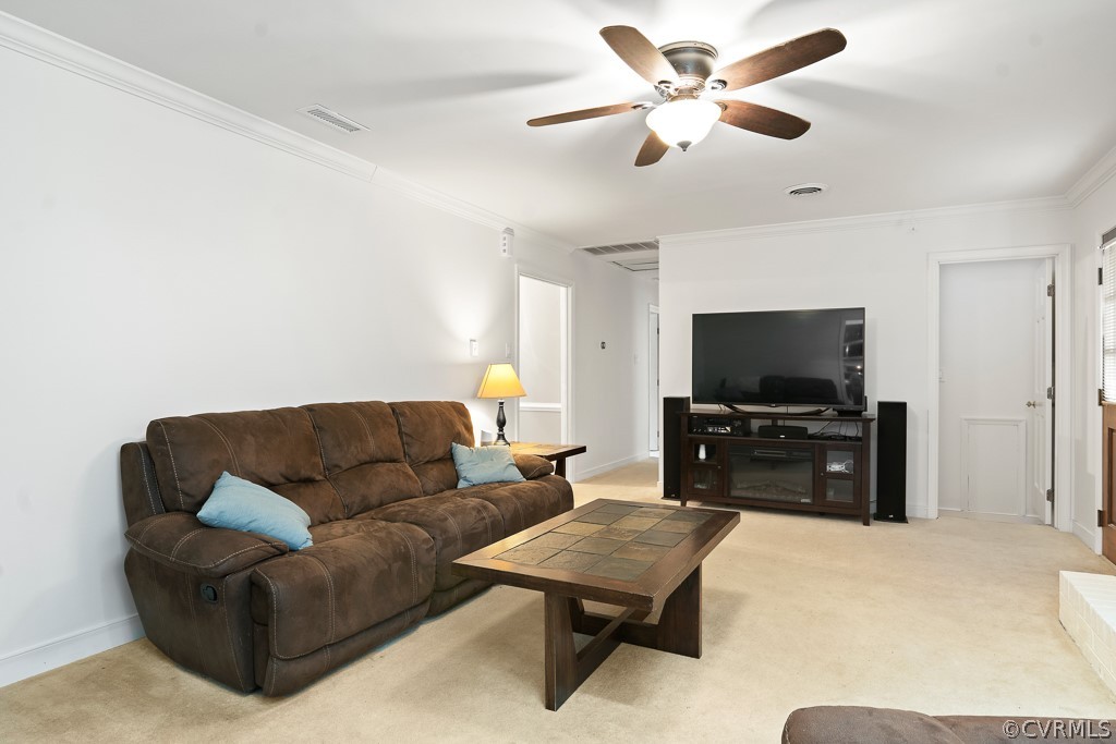 9441 Trails End Road Midlothian, VA 23112 - Photo 13 of 40 a living room with furniture and a flat screen tv
