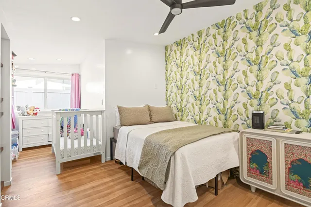 a bedroom with a bed and a book shelf