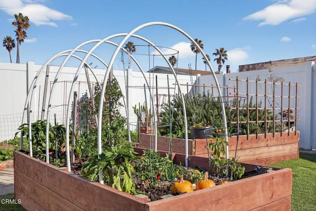 a view of outdoor dining space with a table and chairs