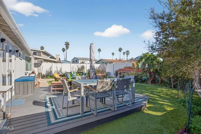 an aerial view of multiple houses with parking