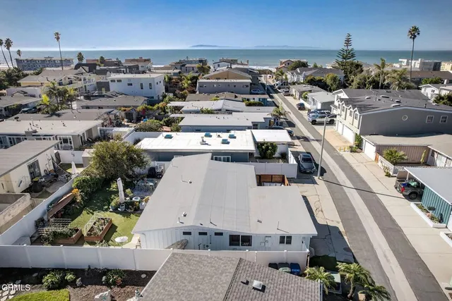 a view of a couches and dinning table in patio