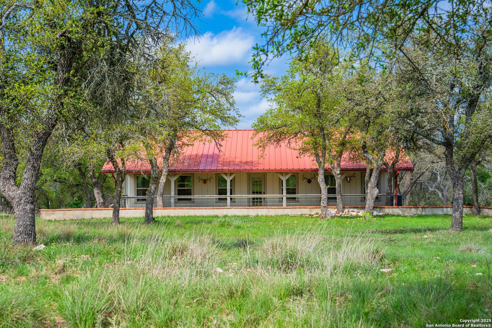 563 J B Road Harper, TX 78631 - Photo 2 of 41 a view of a house with a yard porch and sitting area