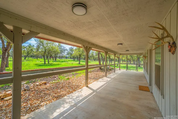 a view of a porch and garden