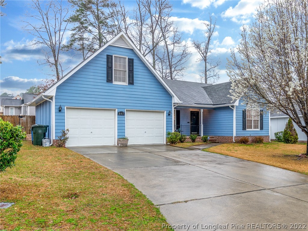 847 Turkey Ridge Drive Fayetteville, NC 28314 - Photo 2 of 31 a front view of a house with a yard and garage
