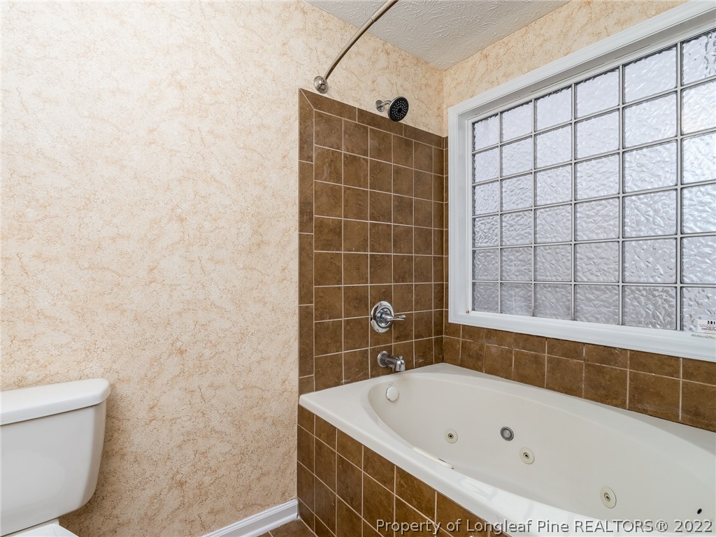 847 Turkey Ridge Drive Fayetteville, NC 28314 - Photo 23 of 31 a bathroom with a bathtub and shower