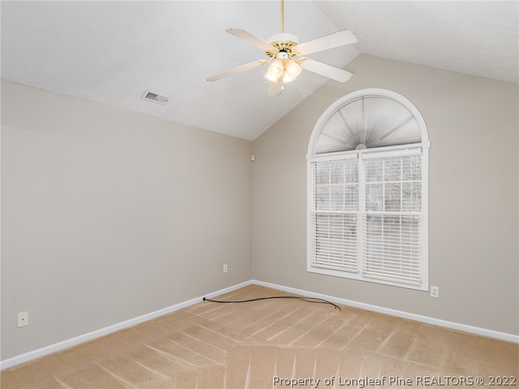 847 Turkey Ridge Drive Fayetteville, NC 28314 - Photo 24 of 31 an empty room with windows and fan