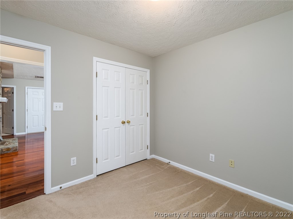 847 Turkey Ridge Drive Fayetteville, NC 28314 - Photo 29 of 31 an empty room with wooden floor