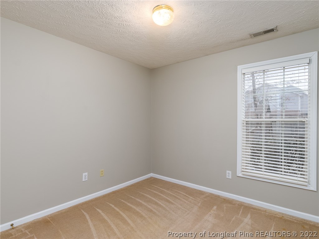 847 Turkey Ridge Drive Fayetteville, NC 28314 - Photo 30 of 31 a view of an empty room with a window