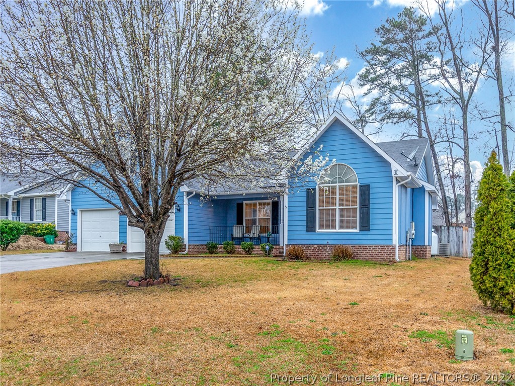 847 Turkey Ridge Drive Fayetteville, NC 28314 - Photo 3 of 31 a front view of house with yard and trees around