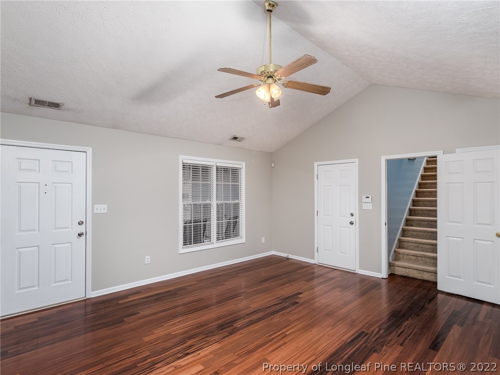 847 Turkey Ridge Drive Fayetteville, NC 28314 - Photo 10 of 31 an empty room with wooden floor fan and windows