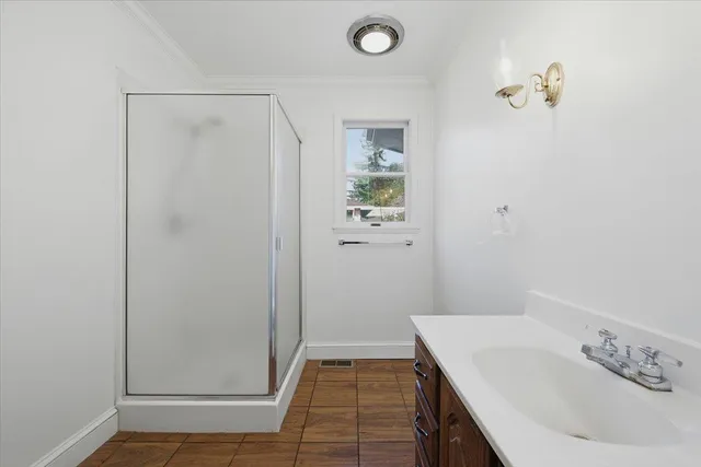 a bathroom with a granite countertop toilet a sink and a mirror