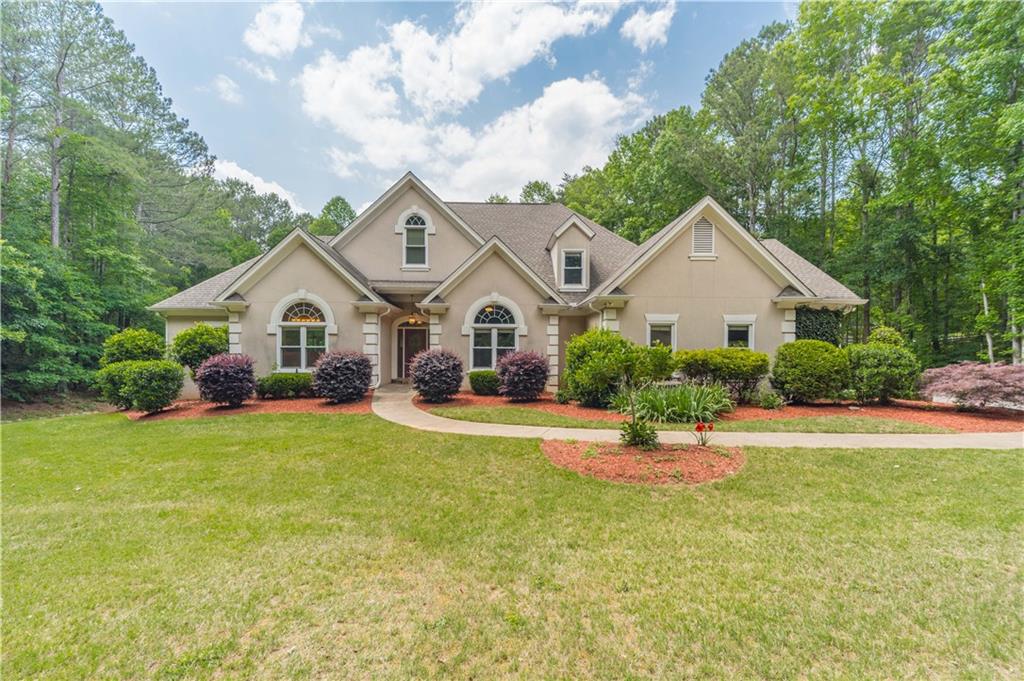 1470 Palm Street Canton, GA 30115 - Photo 1 of 1 a view of a house with backyard and garden