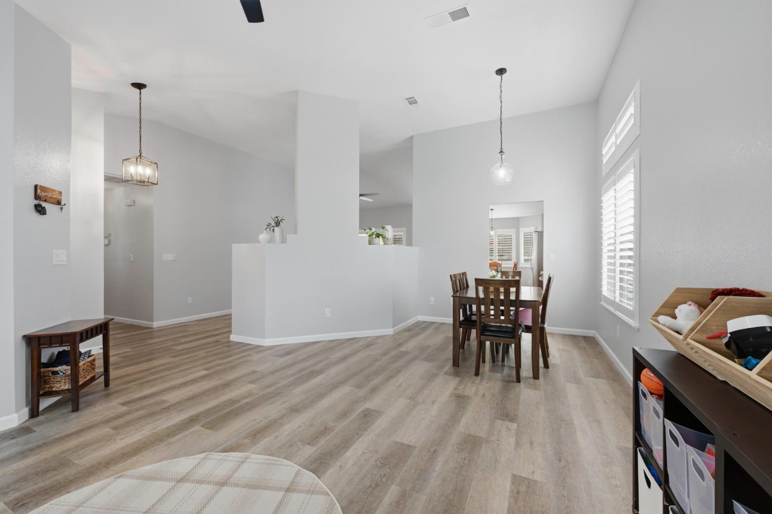 5013 Charter Road Rocklin, CA 95765 - Photo 6 of 35 a view of a dining room with furniture window and wooden floor