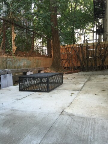 518 Bainbridge Street, Unit 1B Brooklyn, NY 11233 - Photo 7 of 7 a view of a bench in a backyard