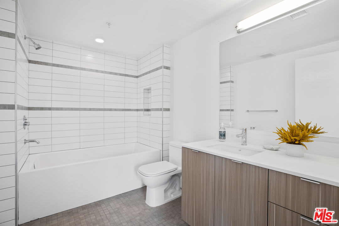 13448 Beach Avenue, Unit PH7314 Marina del Rey, CA 90292 - Photo 11 of 22 a bathroom with a sink a toilet and shower