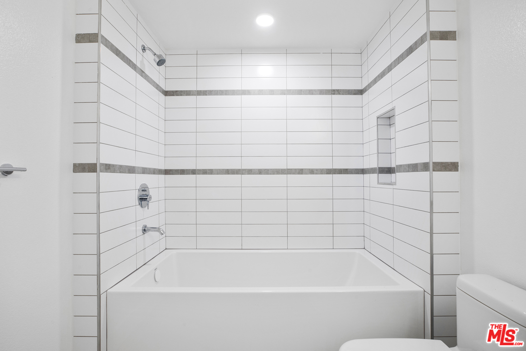 13448 Beach Avenue, Unit PH7314 Marina del Rey, CA 90292 - Photo 12 of 22 a bathroom with a bathtub and shower