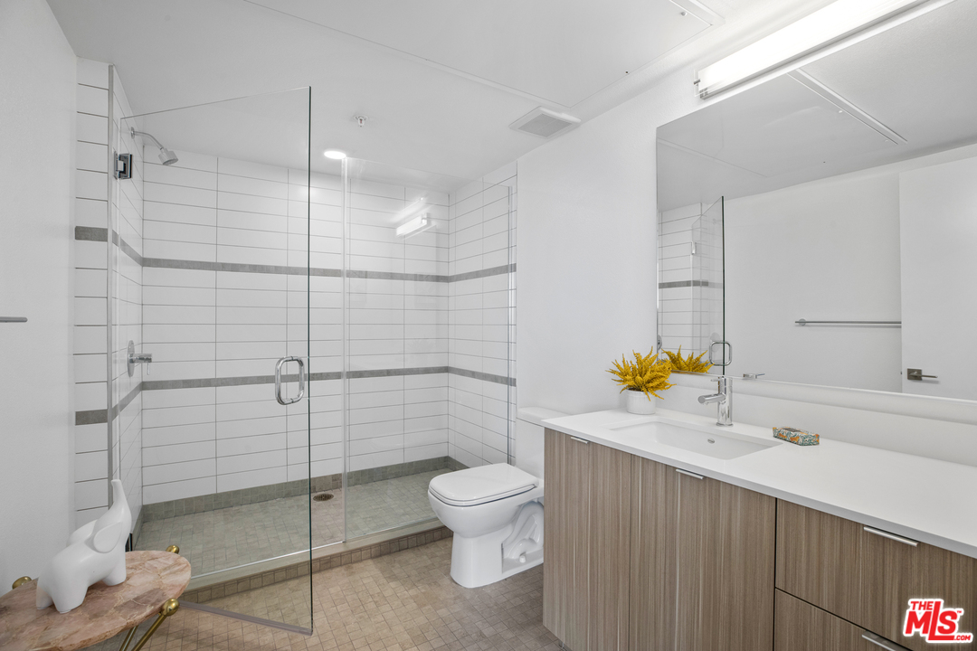 13448 Beach Avenue, Unit PH7314 Marina del Rey, CA 90292 - Photo 16 of 22 a bathroom with a sink a toilet and shower