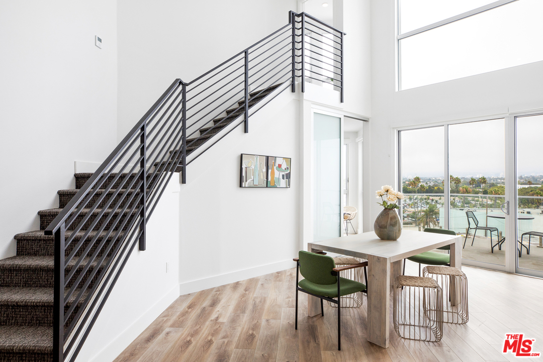 13448 Beach Avenue, Unit PH7314 Marina del Rey, CA 90292 - Photo 2 of 22 a view of a livingroom with furniture and staircase