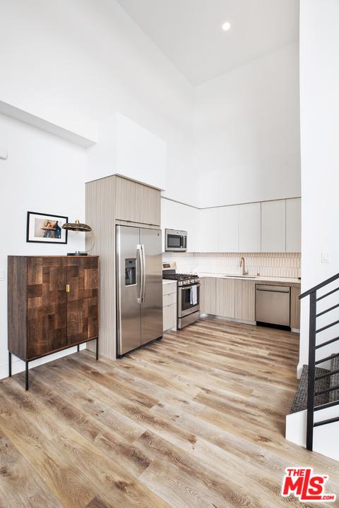13448 Beach Avenue, Unit PH7314 Marina del Rey, CA 90292 - Photo 3 of 22 a kitchen with stainless steel appliances a refrigerator and a stove