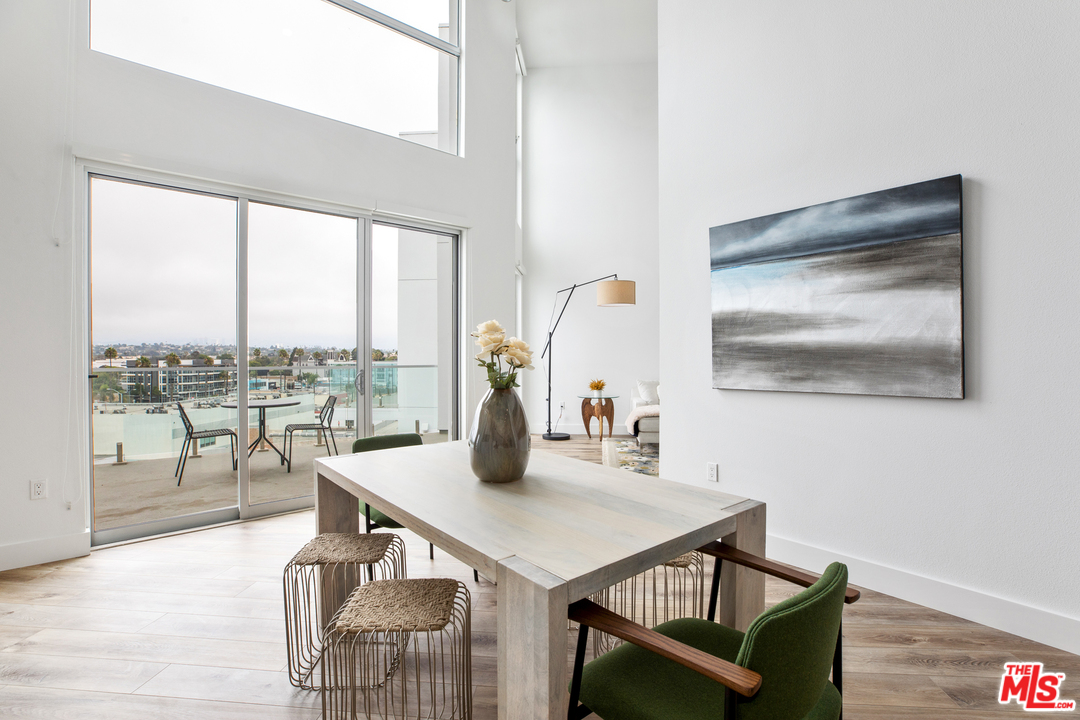 13448 Beach Avenue, Unit PH7314 Marina del Rey, CA 90292 - Photo 4 of 22 a view of a dining room with furniture window and outside view