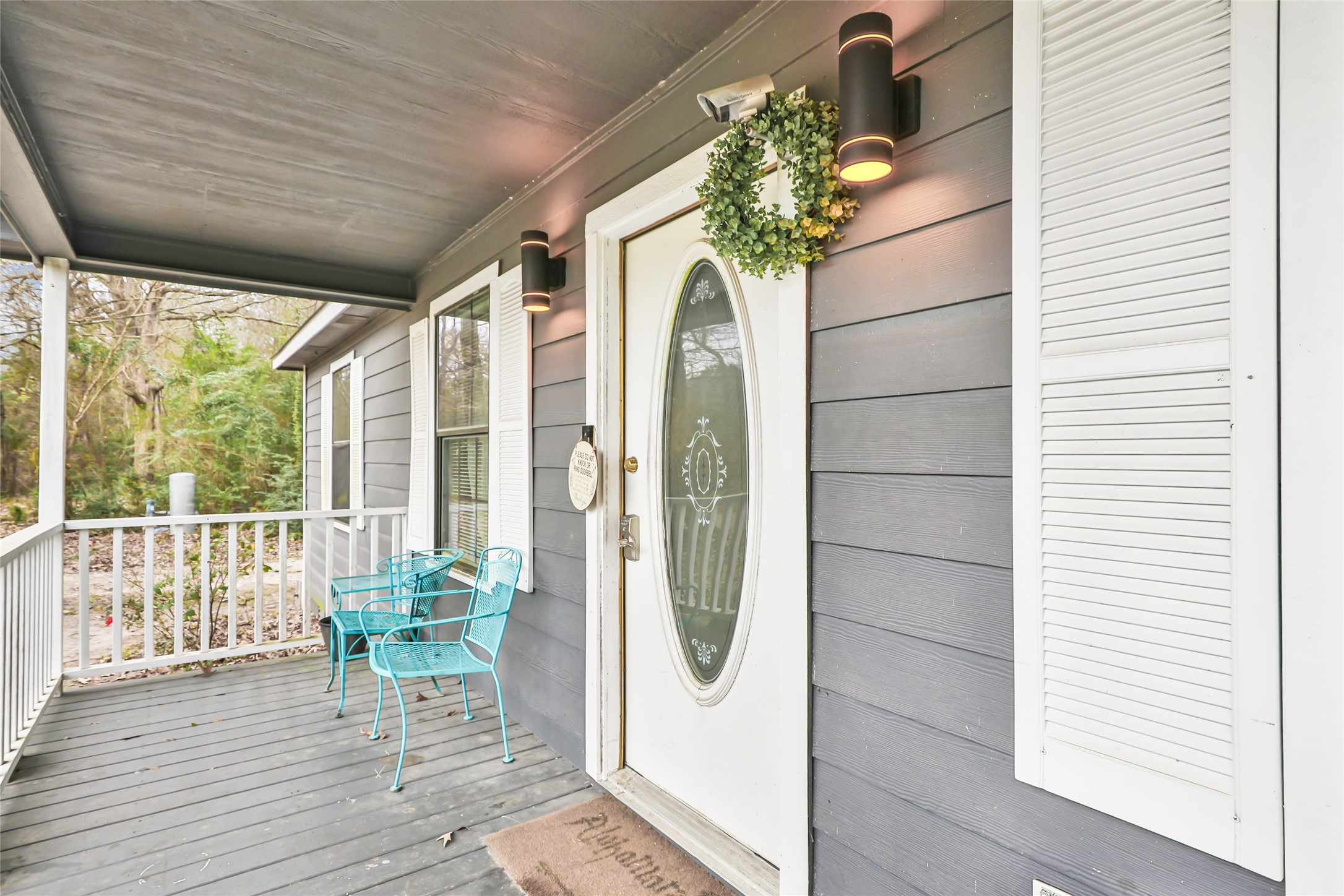 9660 Fostoria Road Cleveland, TX 77328 - Photo 15 of 31 a porch with furniture and potted plants