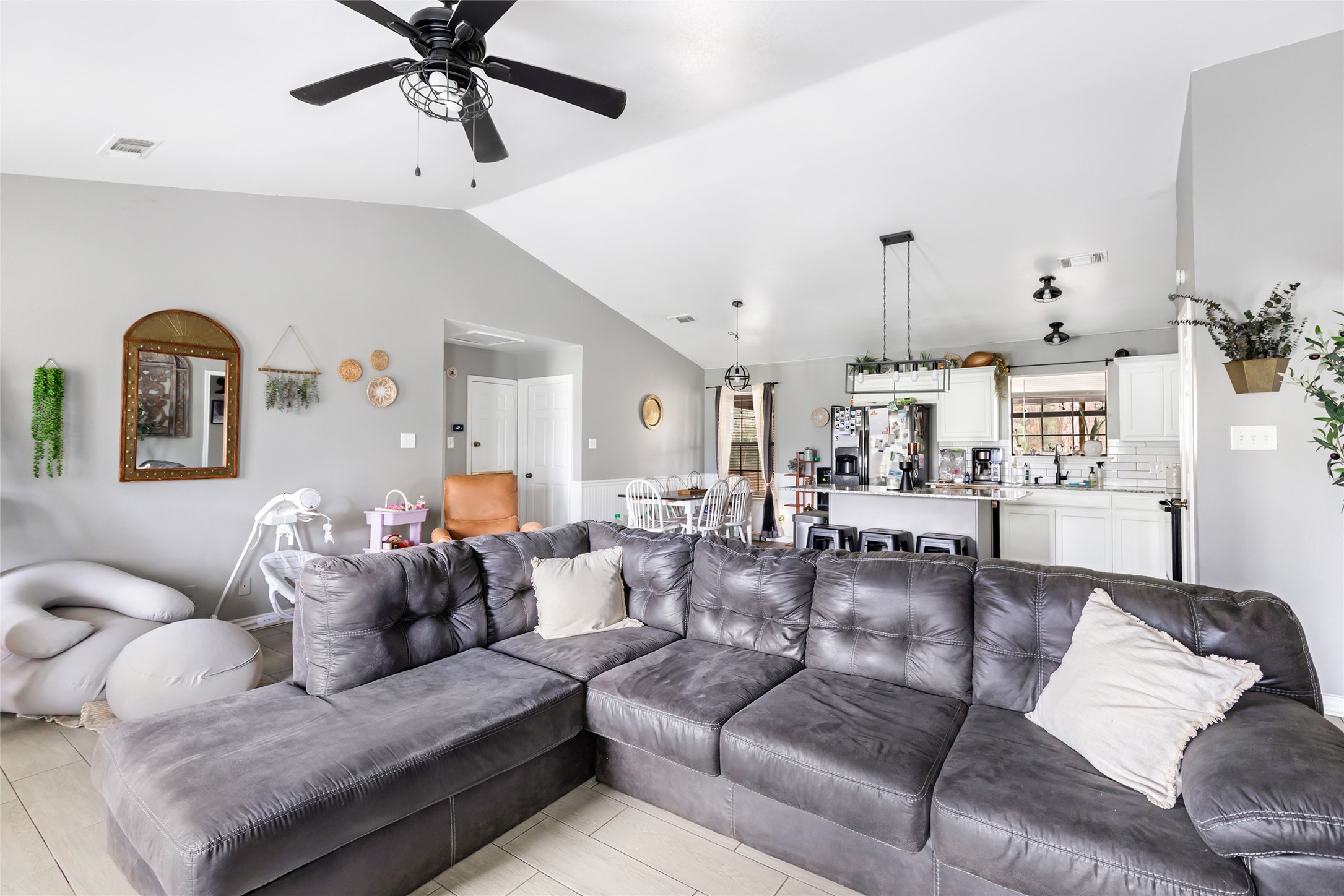 9660 Fostoria Road Cleveland, TX 77328 - Photo 16 of 31 a living room with furniture and wooden floor