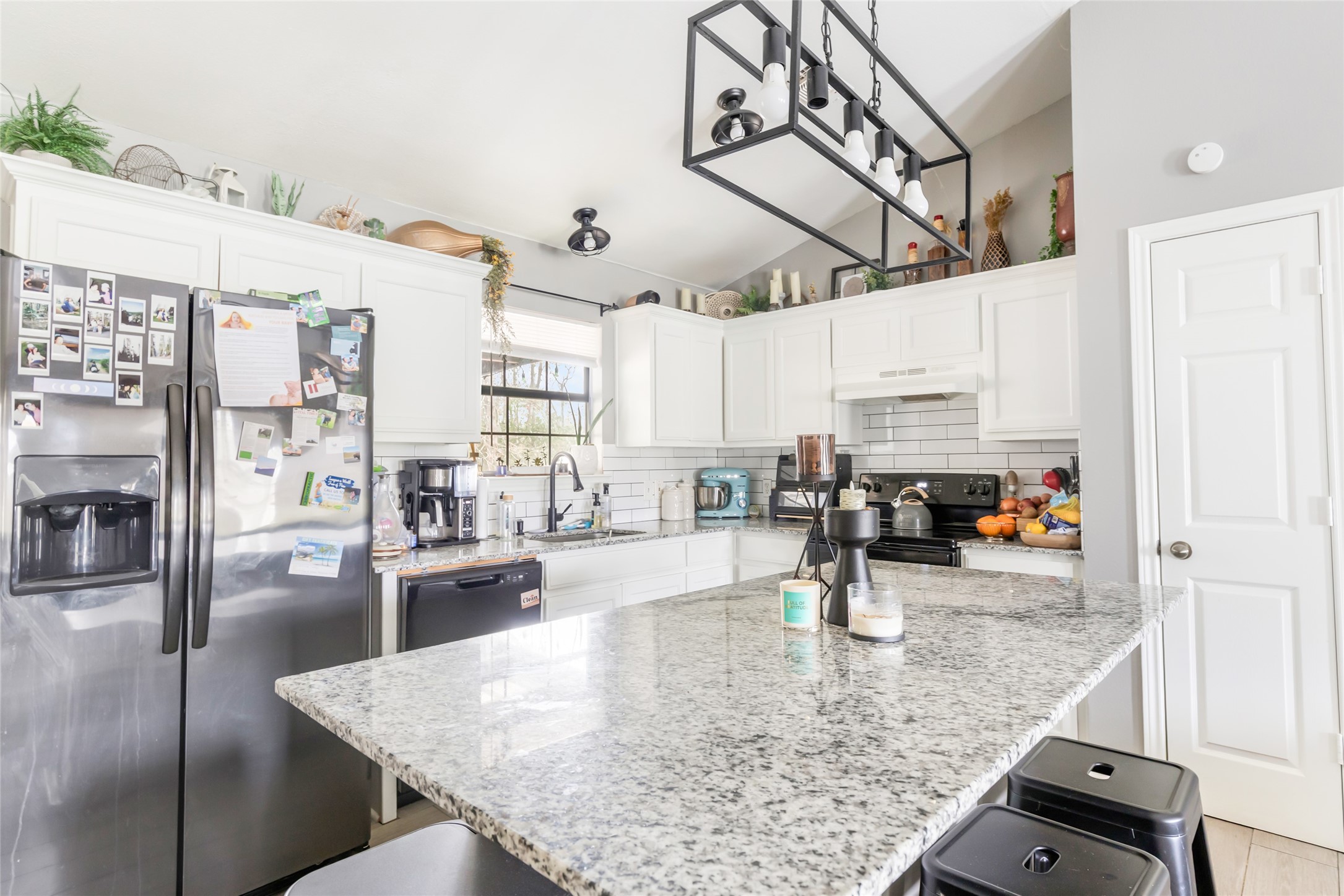 9660 Fostoria Road Cleveland, TX 77328 - Photo 21 of 31 a kitchen with stainless steel appliances granite countertop a sink counter space and cabinets