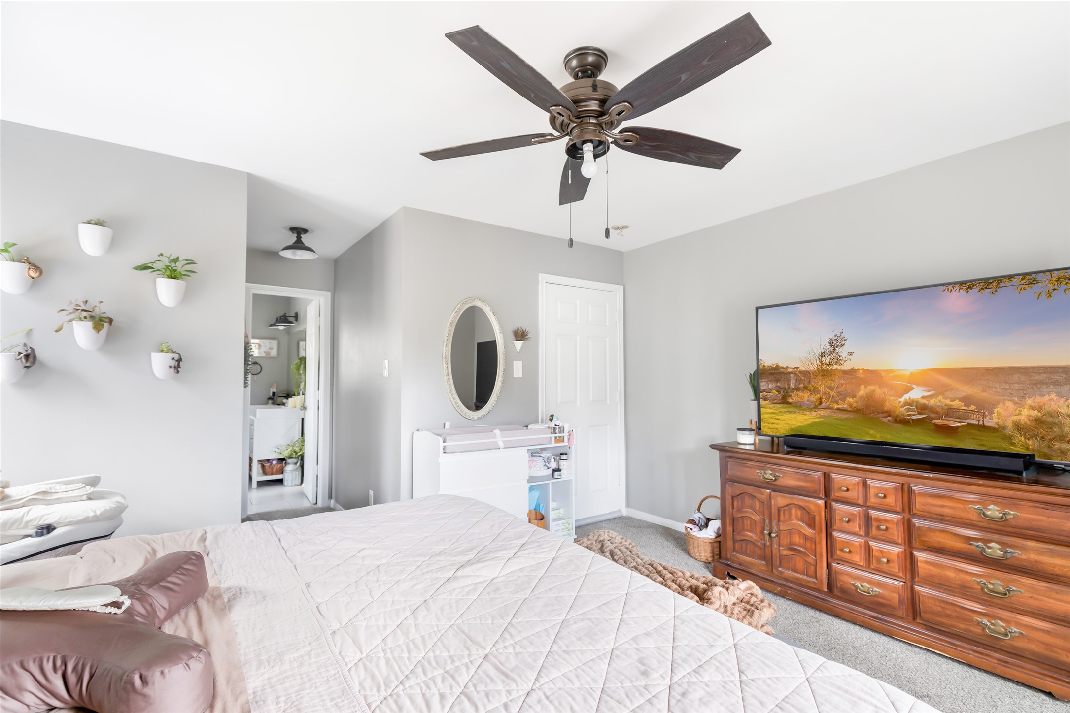9660 Fostoria Road Cleveland, TX 77328 - Photo 27 of 31 a bedroom with a bed and a flat screen tv