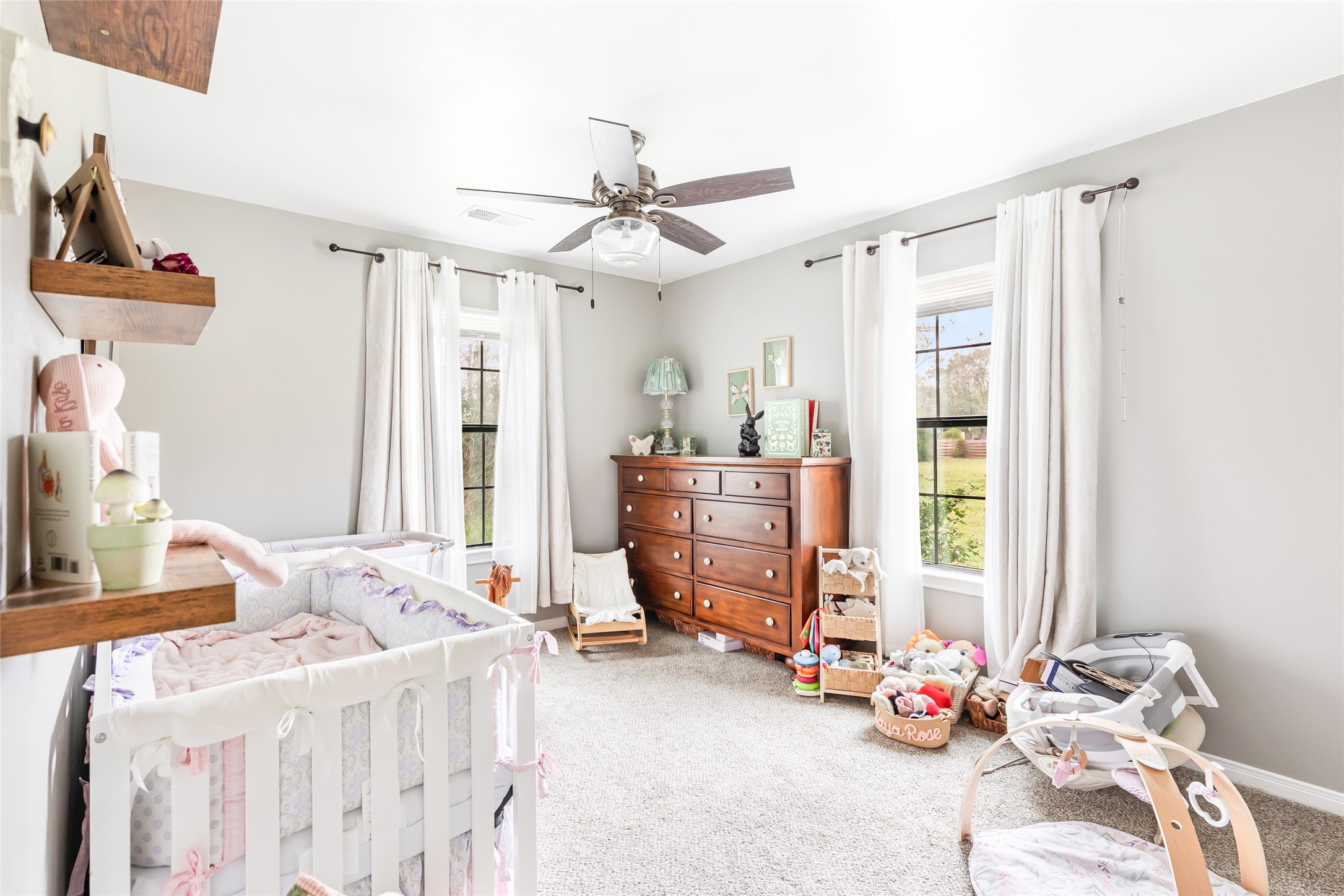9660 Fostoria Road Cleveland, TX 77328 - Photo 29 of 31 a bedroom with furniture and a window