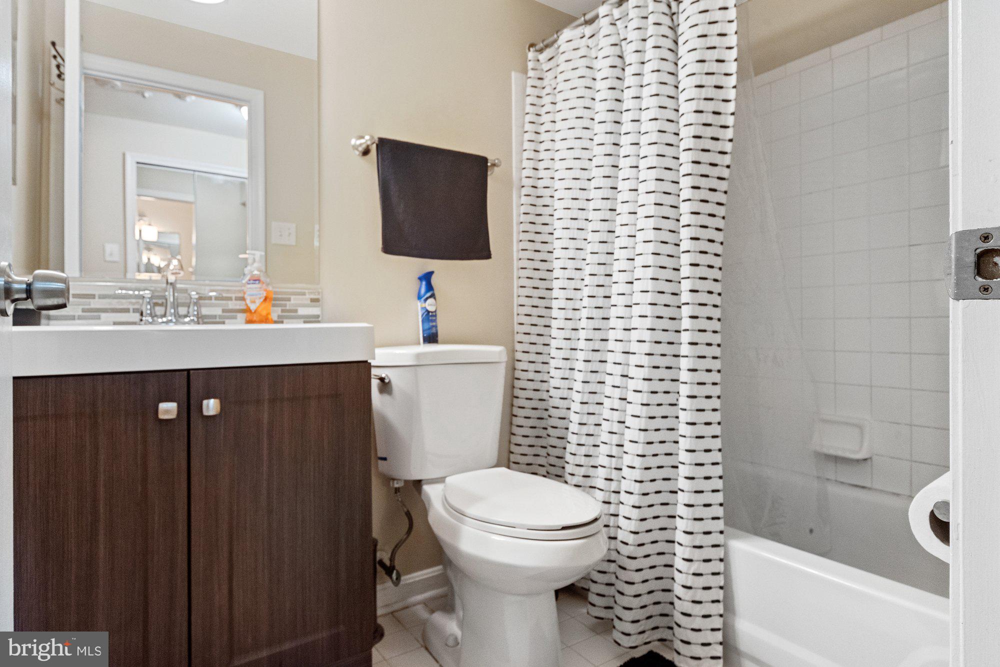 3535 Corn Stream Road Randallstown, MD 21133 - Photo 22 of 25 a bathroom with a sink a toilet and mirror