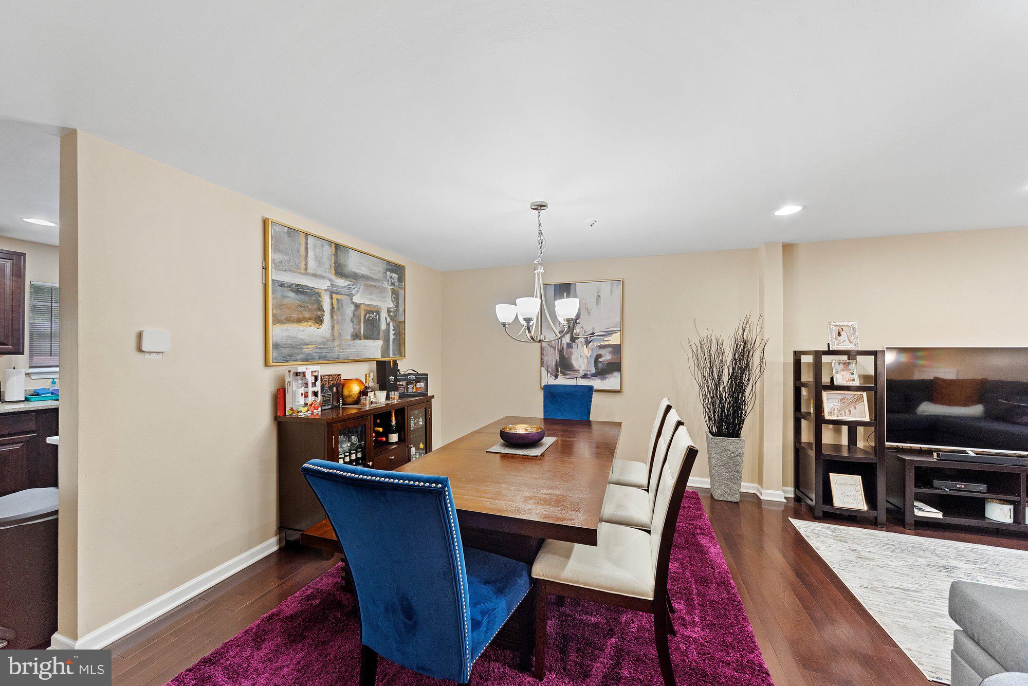 3535 Corn Stream Road Randallstown, MD 21133 - Photo 5 of 25 a view of a dining room with furniture a rug and wooden floor