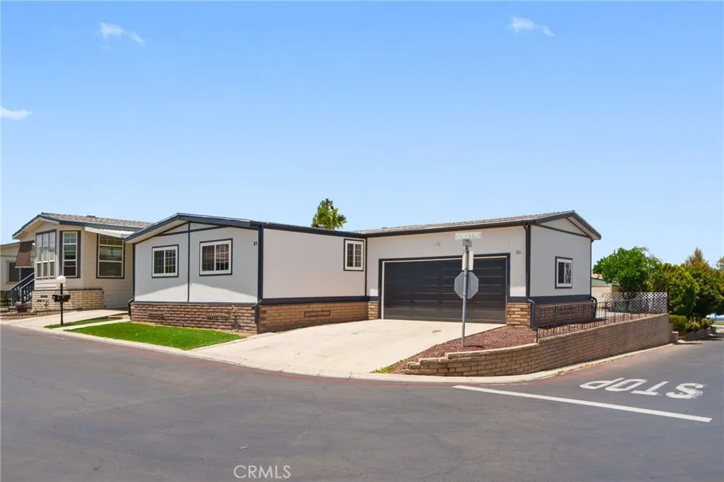 a house with yard in front of it