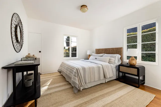 a bedroom with bed and a window