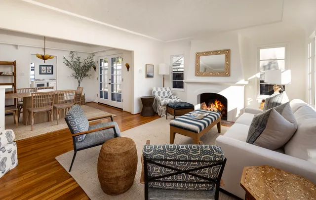 a living room with furniture couches and a fireplace