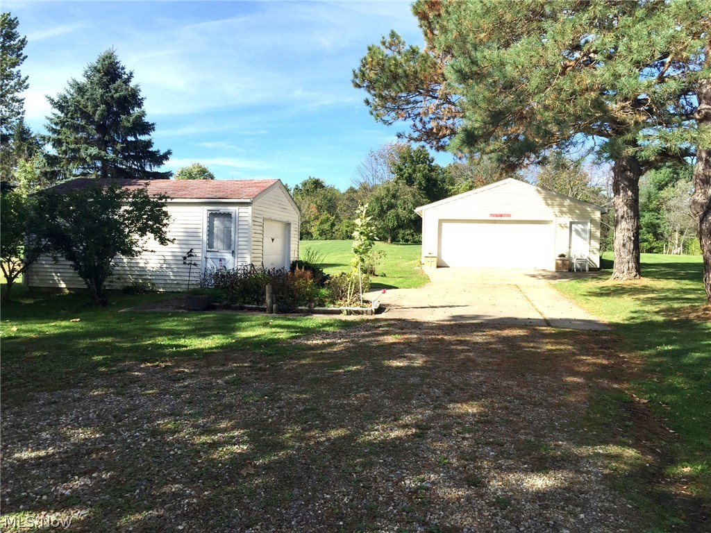 6474 Carsten Road Medina, OH 44256 - Photo 24 of 25 These 2 garages will hold 3 cars. One could be used for the storage of a motorcycle, lawn equipment or turn it into a workshop!