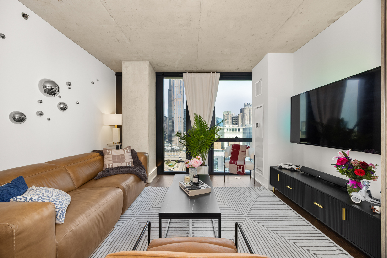 Undisclosed Address Chicago, IL 60607 - Photo 17 of 44 a living room with furniture and a flat screen tv