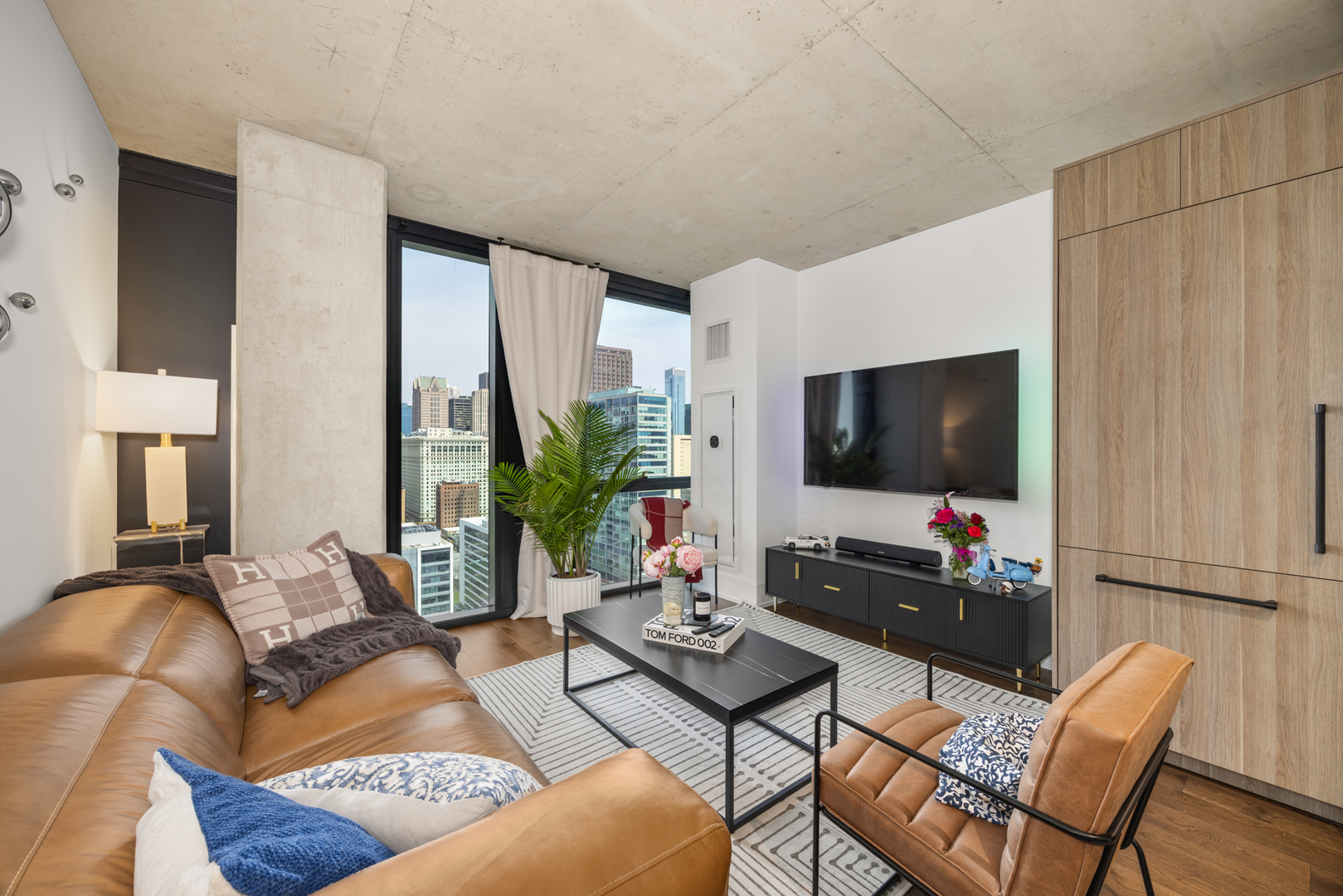 Undisclosed Address Chicago, IL 60607 - Photo 18 of 44 a living room with furniture and a flat screen tv